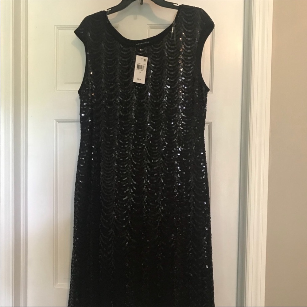 Black cocktail dress.... forgiving and flattering.